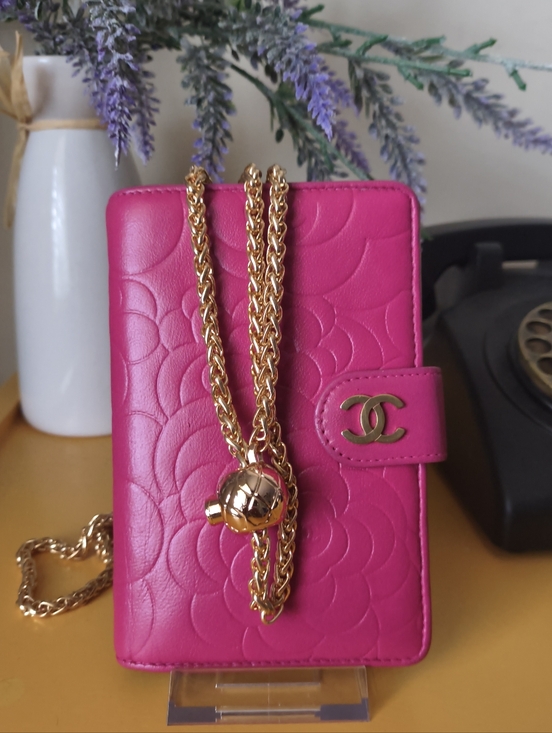 CHANEL Handbags - CHANEL Pink Camellia Embossed Compact Wallet W Chain 2010